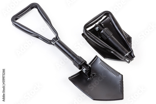 Folded and unfolded modern steel entrenching tools on white background