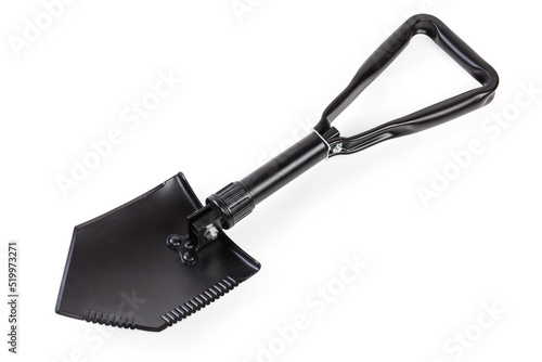 Modern folding steel entrenching tool on a white background