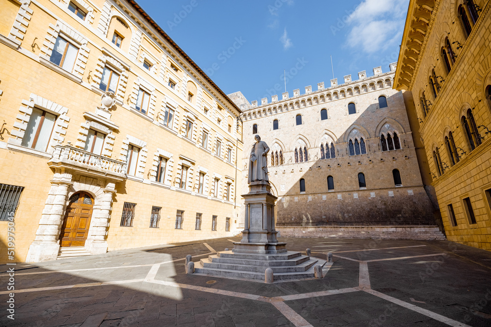Fototapeta premium View on Piazza Salimbeni with Statue of Sallustio Bandini in Siena old town in Italy