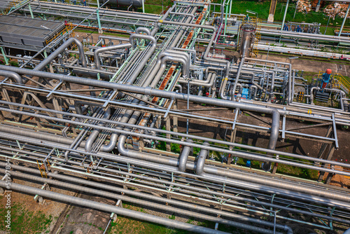 Steel long pipes flowing symbol and pipe elbow in station oil factory during refinery Petrochemistry industry in gas site