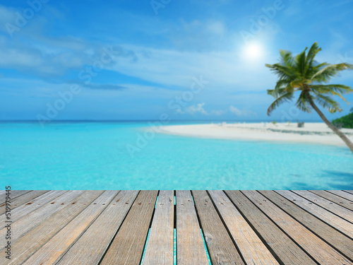 Empty top of wood table with turquoise seascape of maldives, ready for product display montage, summer vacation background concept