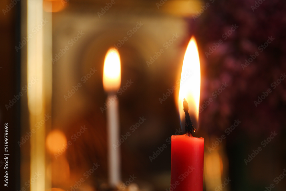 Red burning candle in church, closeup. Space for text Red burning candle in church, closeup. Space for text