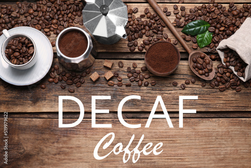Flat lay composition with decaf coffee beans on wooden table photo