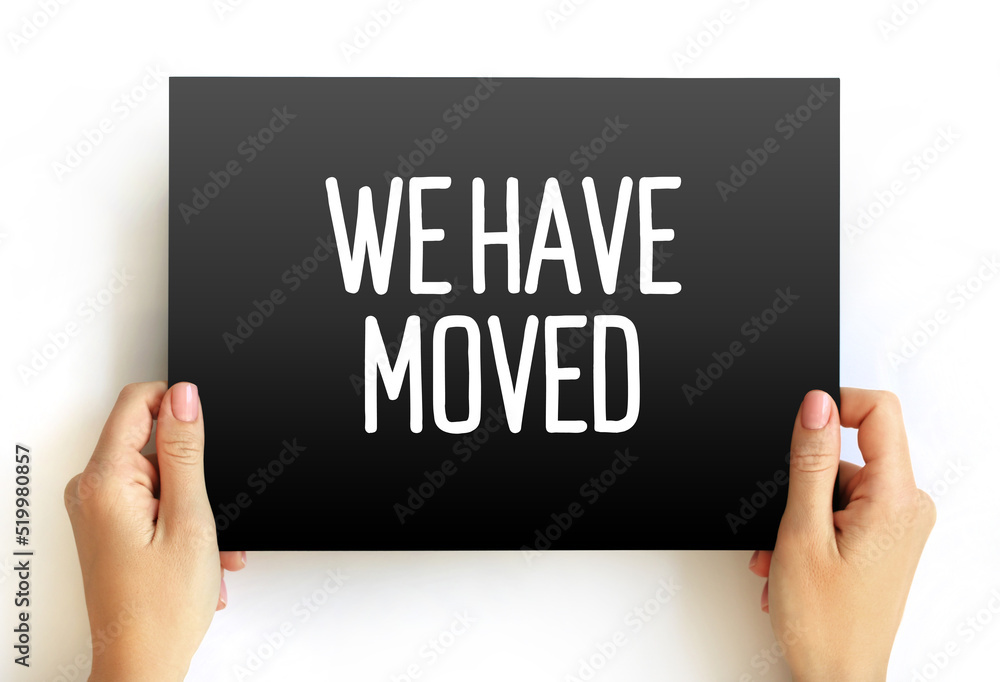 WE HAVE MOVED text business concept on card for presentations and reports WE HAVE MOVED text business concept on card for presentations and reports