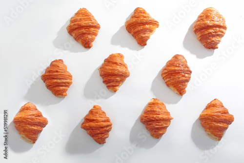 Croissants on a white background. Handmade croissants that are not perfect in shape.View from above. Pattern on white background. Flat lay.Top view.