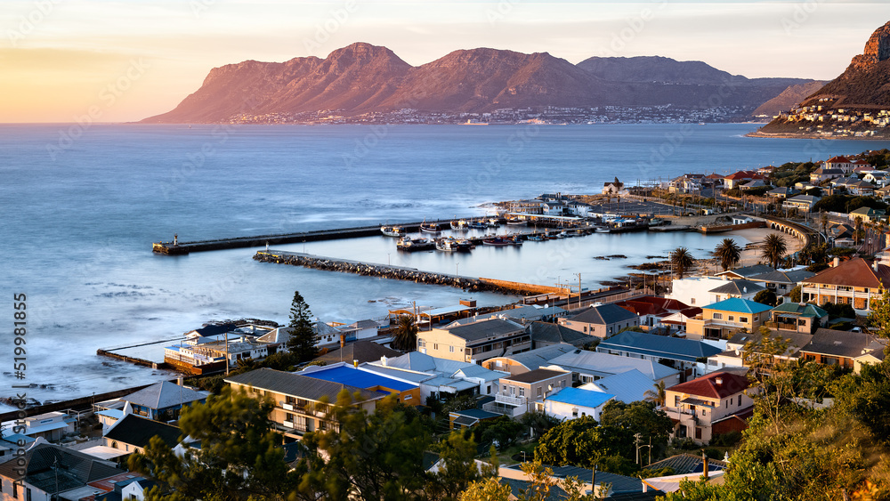 Sunrise view of Kalk Bay Harbour and False Bay. Cape Town, South Africa.