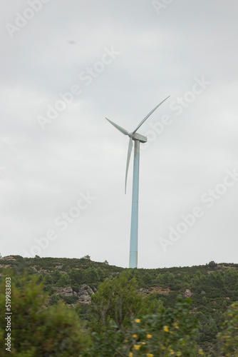 Wind turbines. Windmill in motion generating clean and renewable energy on a cloudy day, in Spain. Europe. Photography.