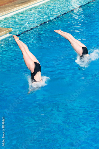Принти на полотні Aquatic Pool Diving Girls Pairs Action Half and Half Entry Into Blue Waters