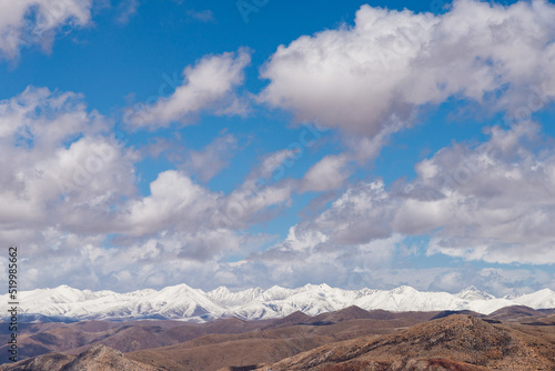 Barren mountain ranges with snow-capped mountain peaks