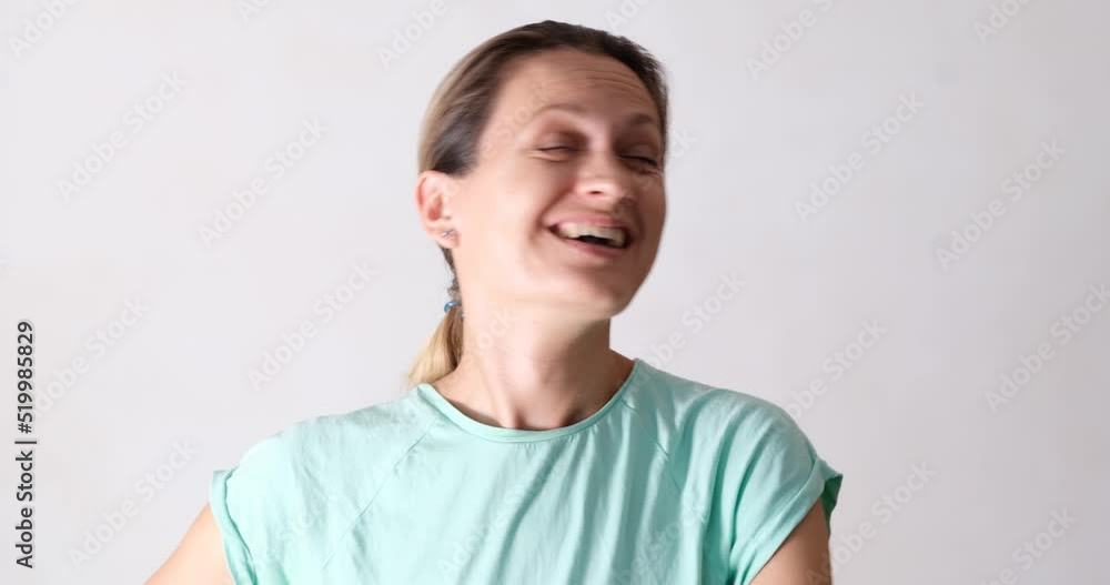Surprised joyful woman laughs, close-up Surprised joyful woman laughs, close-up