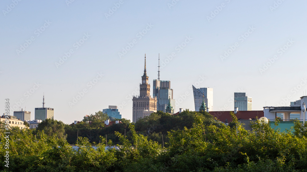 view from the park to the city center.  skyline of Warsaw city.  buildings in the fog on the background.  view of Warsaw, Stalinka building