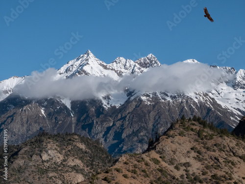 Majestic sky-high rocky snow-capped mountains