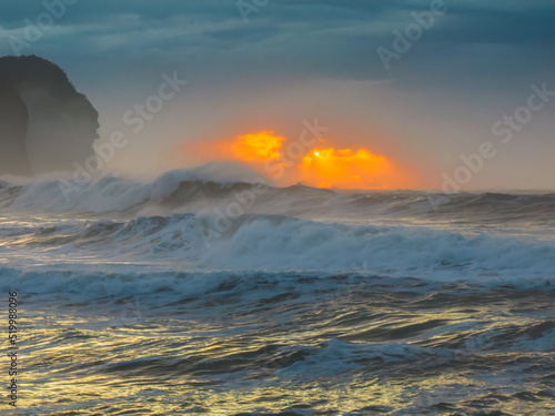 Sunrise at the seaside with large and powerful sets