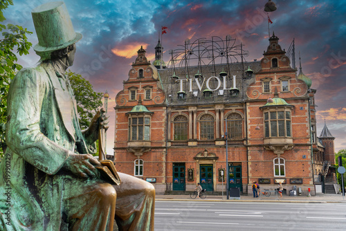 Hans Christian Andersen statue and Tivoli building facade, built in 1843. Entrance to Tivoli Garden, one of the oldest operating amusement parks in the world.  Copenhagen - Denmark photo