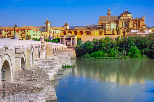 Cordoba  Spain. Roman Bridge on Guadalquivir river and The Great Mosque  Mezquita Cathedral  in the city of Cordoba  Andalusia.