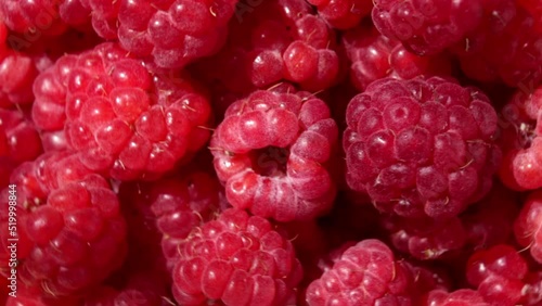 Close up rotation raspberry. Macro red fresh raspberries fruit Rotation. Raspberries are spinning in close-up. Juicy healthy berry for healthy diet. Summer vegetarian healthy food.