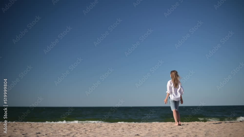 Romantic girl on sea background. Wind shakes long blond hair. Romantic girl on sea background. Wind shakes long blond hair.