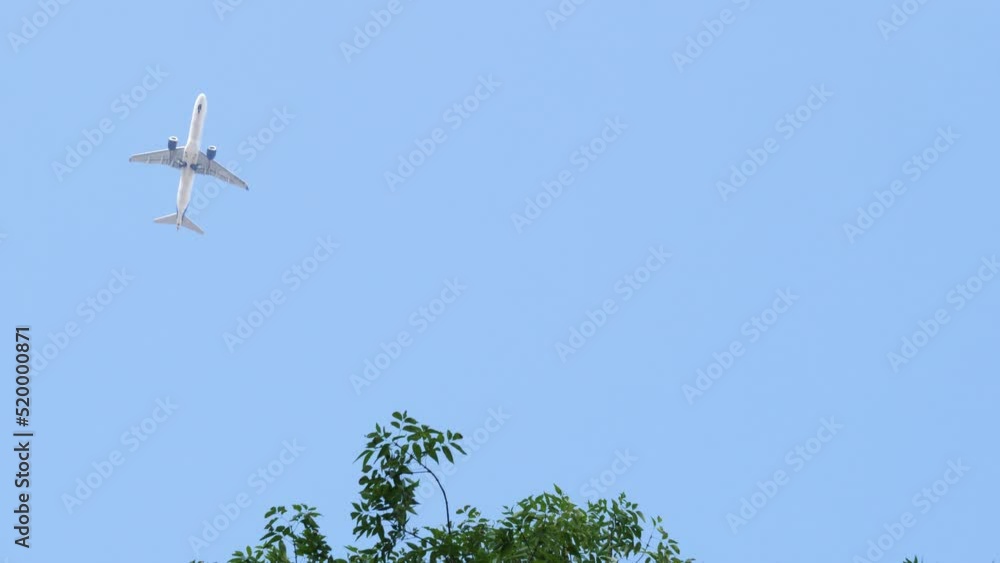 Commercial airliner flying across the sky Aircraft on flight. Airliner approaching landing. Passenger airplane on the top.
Flying airplane approaching airstrip.
