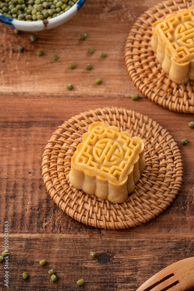 Delicious mung bean moon cake for Mid-Autumn Festival food mooncake on dark wood table background. Delicious mung bean moon cake for Mid-Autumn Festival food mooncake on dark wood table background.