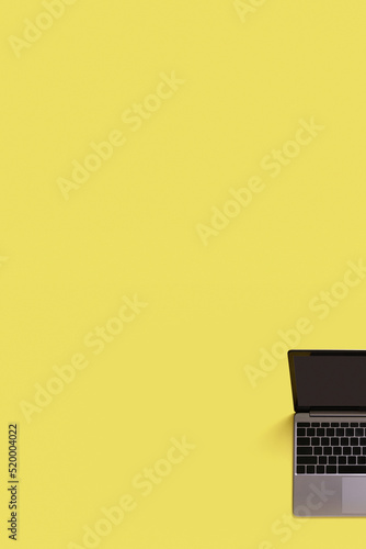 Top view fragment of modern laptop isolated on colored background. Copy space photo