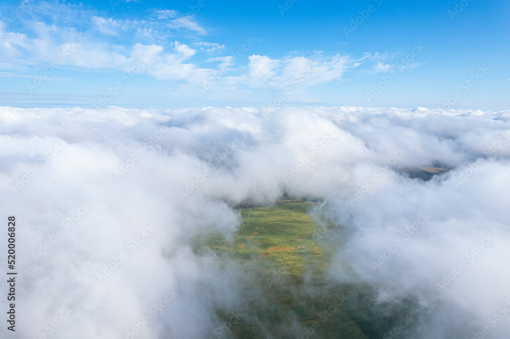 Flying over beautiful fluffy clouds