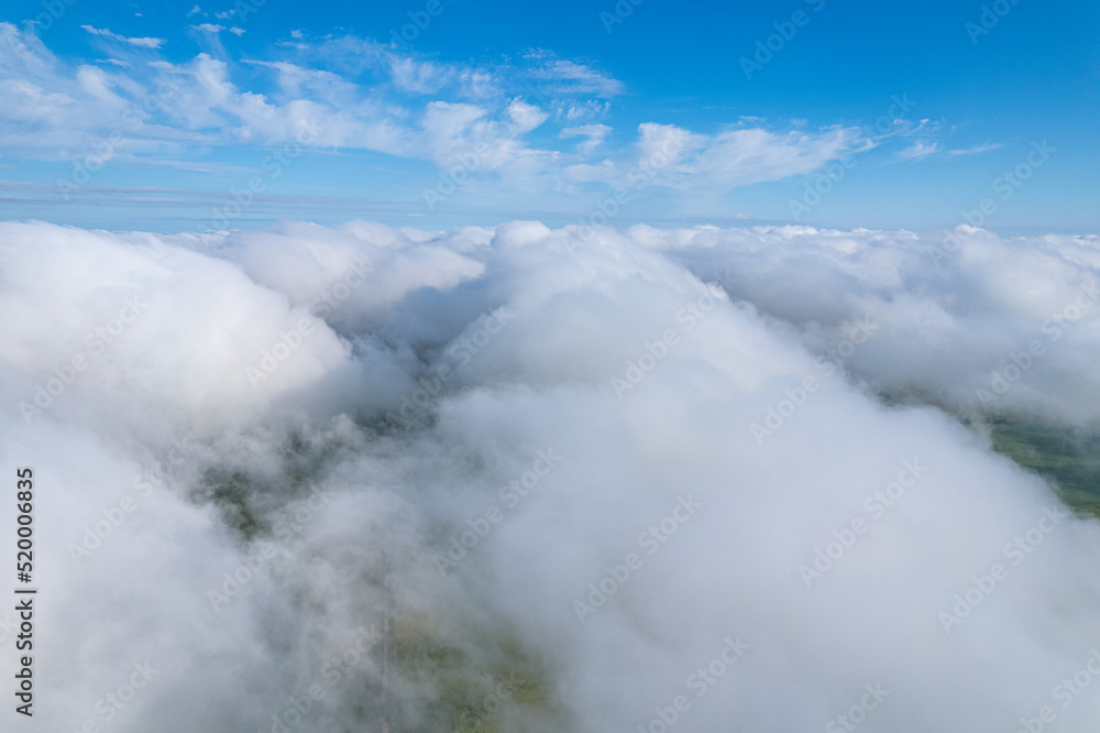 Obraz premium Flying over beautiful fluffy clouds