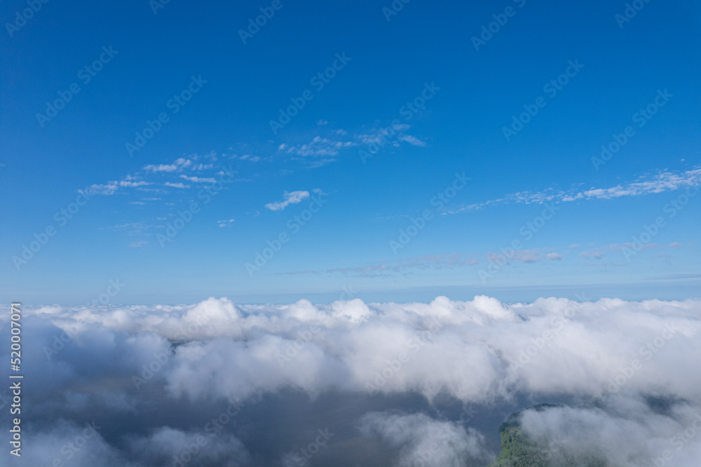 Flying over beautiful fluffy clouds Flying over beautiful fluffy clouds
