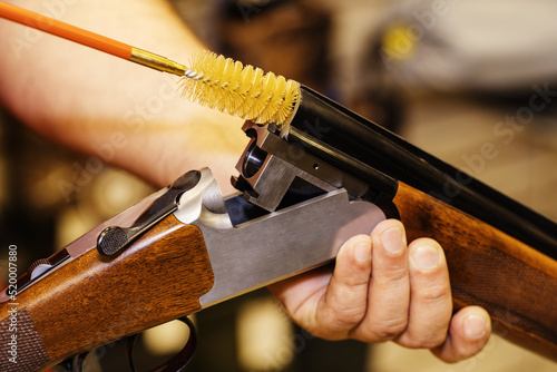 A ramrod for cleaning weapons. Shotgun barrel cleaning process. Care of firearms with the help of special tools. Close-up