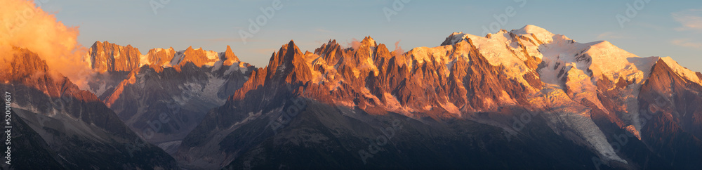 The panorama of Mont Blanc massif  Les Aiguilles towers and Grand Jorasses in the sunset light.