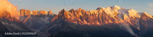 The panorama of Mont Blanc massif Les Aiguilles towers and Grand Jorasses in the sunset light.