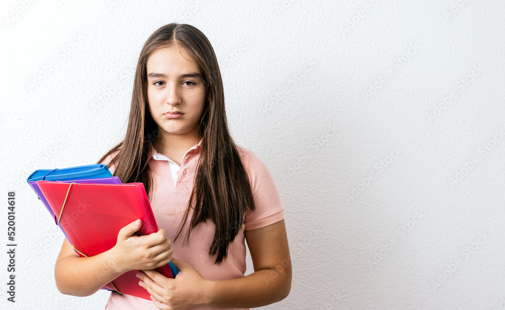 Teenage student is looking with an annoyed face Teenage student is looking with an annoyed face