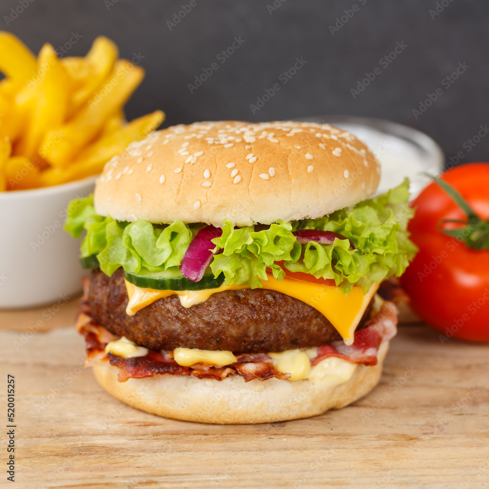 Hamburger Cheeseburger meal fastfood fast food with French Fries on a wooden board square Hamburger Cheeseburger meal fastfood fast food with French Fries on a wooden board square
