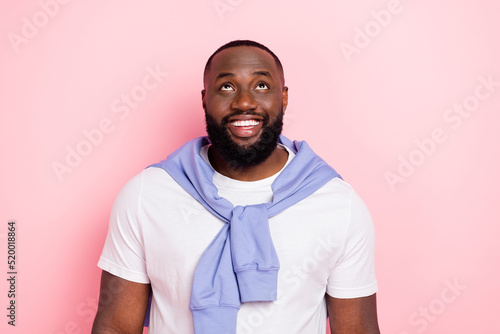 Photo of good mood cheery man look up see black friday shopping promo sales ad isolated on pink color background