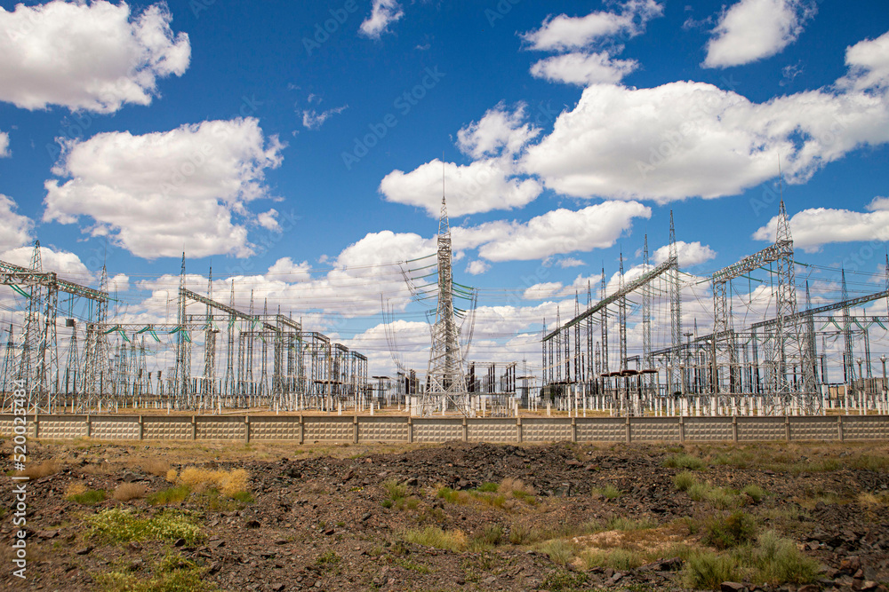 large electrical substation in the desert against the blue sky large electrical substation in the desert against the blue sky