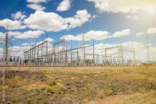 large electrical substation in the desert against the blue sky © Torkhov