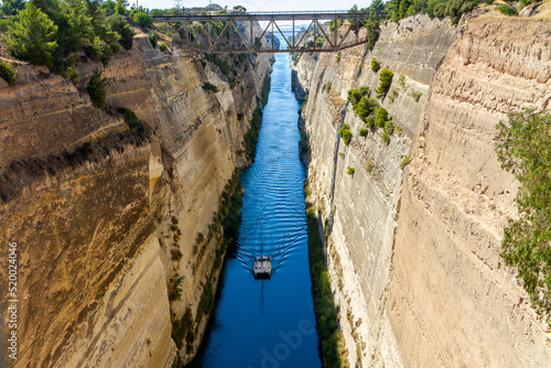 Corinth, Greece, July 16, 2022. The Corinth Canal is an artificial waterway carved through the Isthmus of Corinth, Greece photo