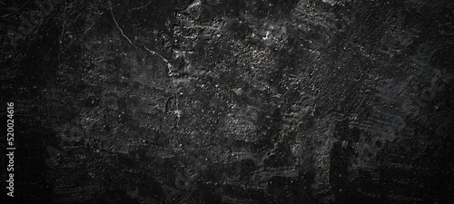 Dark black stone background. scary black concrete texture. Stone wall background.