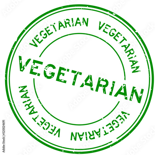 Grunge green vegetarian word round rubber seal stamp on white background