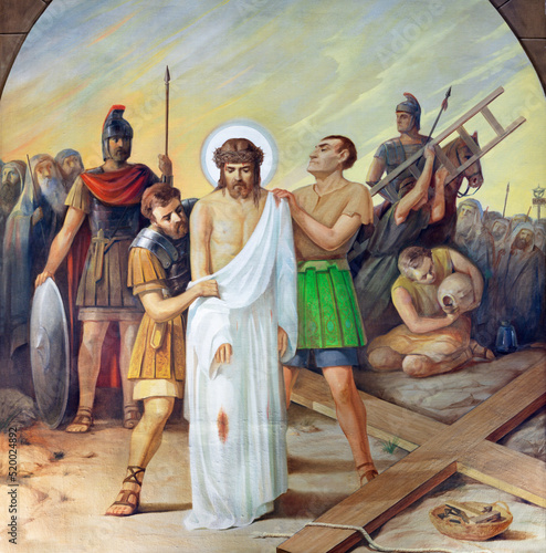 VALENCIA, SPAIN - FEBRUAR 17, 2022: The painting   Jesus clothes are taken aw...