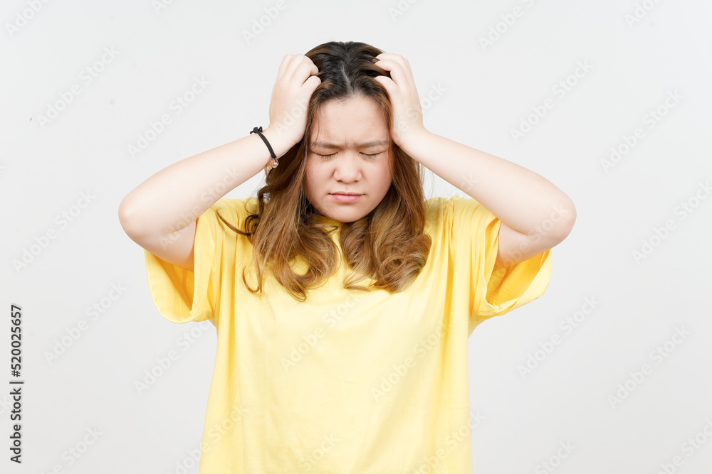 Suffering Headache of Beautiful Asian Woman wearing yellow T-Shirt Isolated On White Background Suffering Headache of Beautiful Asian Woman wearing yellow T-Shirt Isolated On White Background