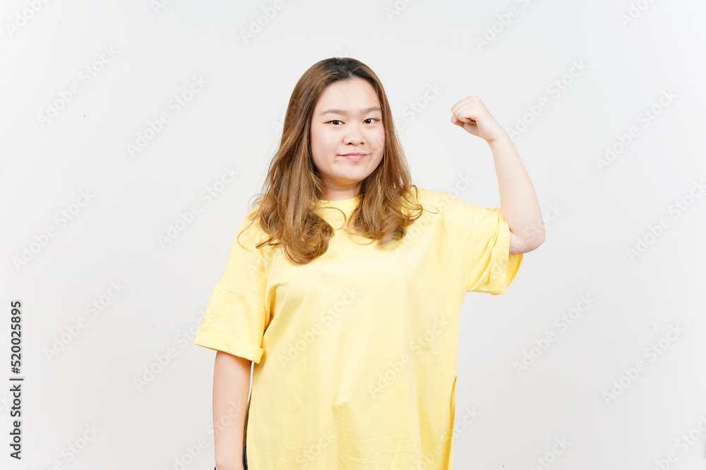 Showing Strength Arms of Beautiful Asian Woman wearing yellow T-Shirt Isolated On White Background Showing Strength Arms of Beautiful Asian Woman wearing yellow T-Shirt Isolated On White Background