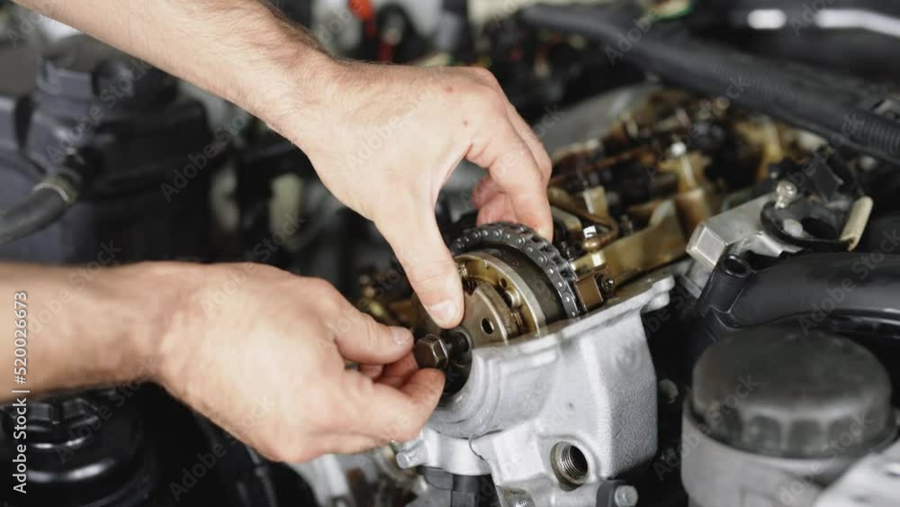 Auto Mechanic Working on Car Engine in Garage. Repair service. Auto Car Mechanic Workshop Repair Car Engine. Internal Combustion Engine Parts Auto Mechanic Working on Car Engine in Garage. Repair service. Auto Car Mechanic Workshop Repair Car Engine. Internal Combustion Engine Parts