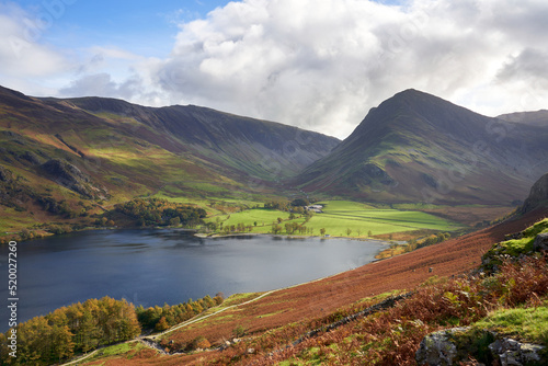 Views of Gatesgarth on the waters edge below the summits of Dale Head and Fleetwith Pike near Buttermere in the Autumn in the Lake District, UK.