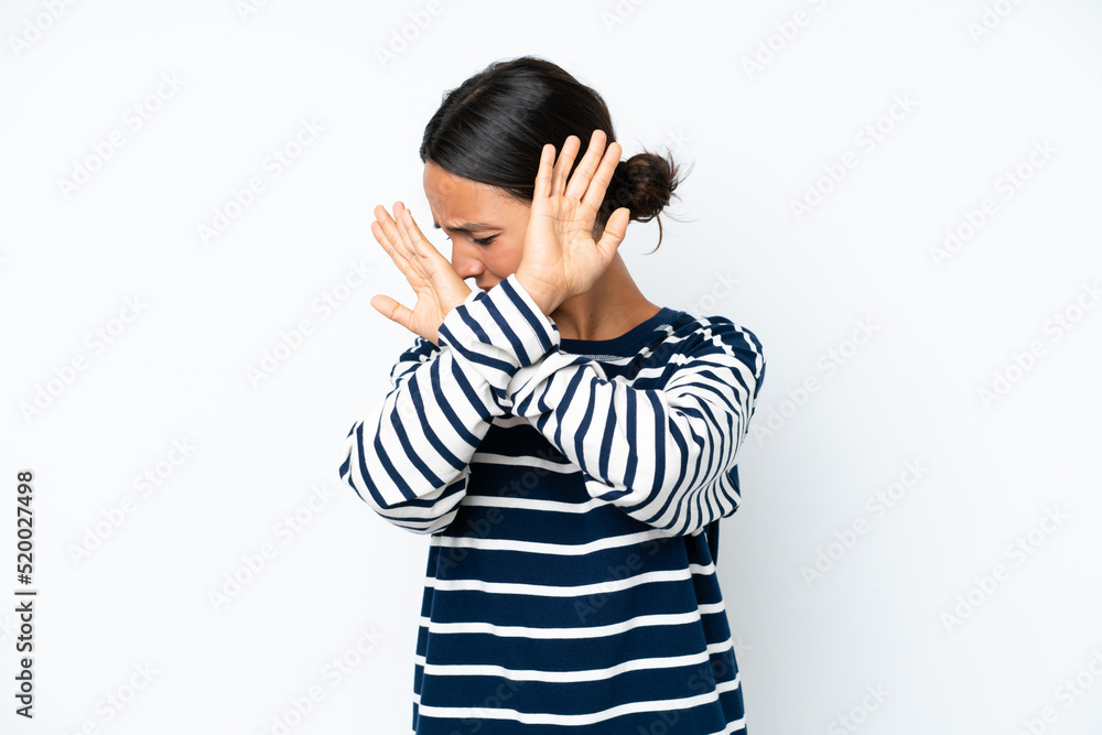 Young hispanic woman isolated on white background nervous stretching hands to the front Young hispanic woman isolated on white background nervous stretching hands to the front