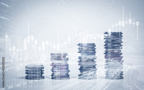 Double exposure of graph and rows of coins for finance, saving, banking, business concept.