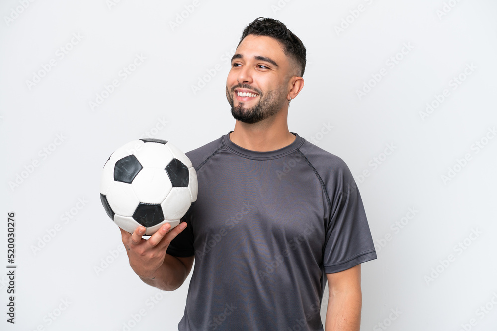 Arab young football player man isolated on white background thinking an idea while looking up Arab young football player man isolated on white background thinking an idea while looking up