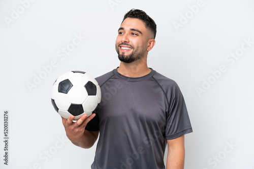 Arab young football player man isolated on white background thinking an idea while looking up