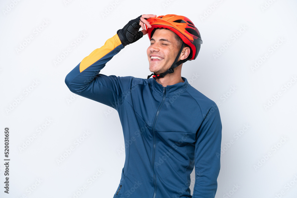 Young cyclist caucasian man isolated on white background smiling a lot Young cyclist caucasian man isolated on white background smiling a lot