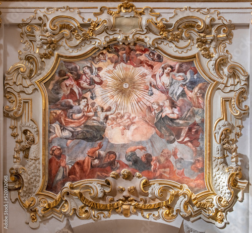 VALENCIA, SPAIN - FEBRUAR 17, 2022: The baroque fresco and stucco Glory of Eucharist in the church Iglesia de San MarÃ­n by JosÃ© Vergara Gimeno (1726-1799).