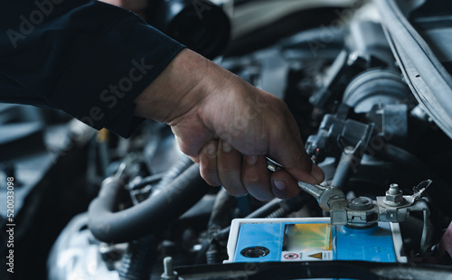 Fotografie, Obraz A Professional mechanic providing car repair and maintenance service in auto garage